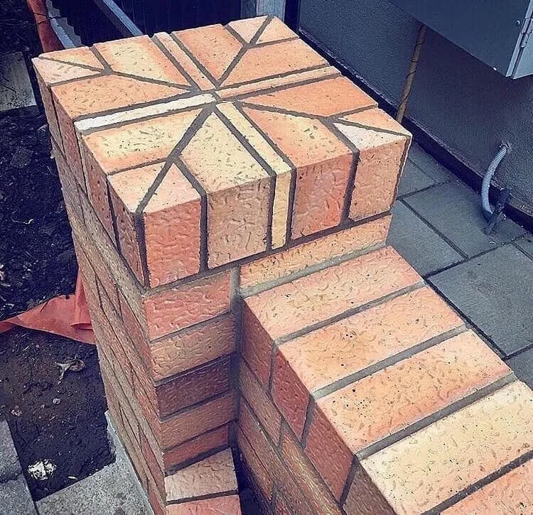 Detail of a decorative brick pier with a geometric pattern