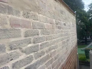 Weathered sandstone block wall